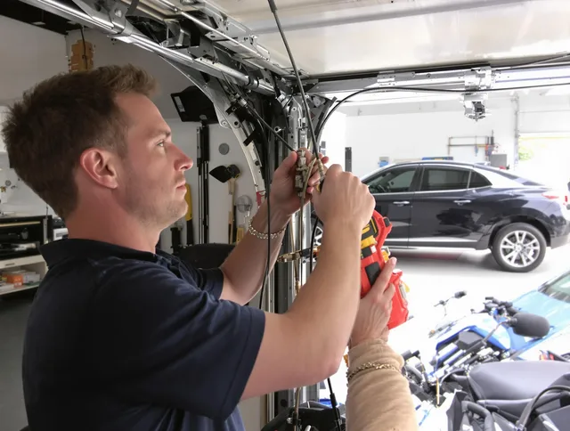 Sagamore Hills Garage Door Repair safety certified technician performing cable replacement in Sagamore Hills