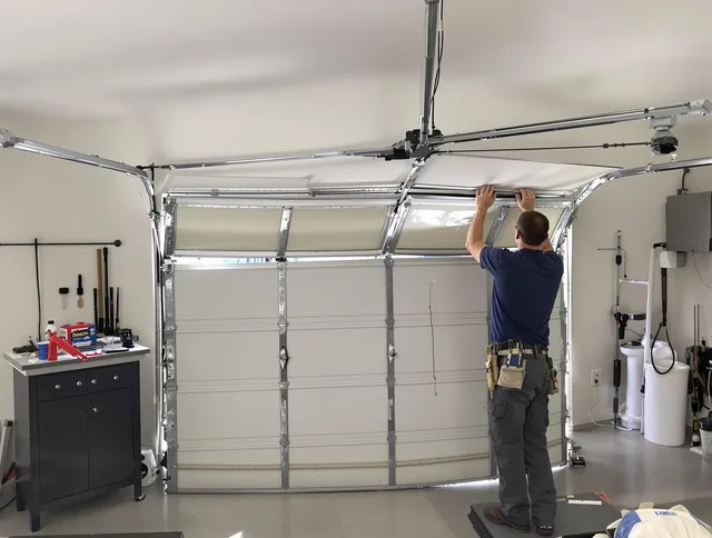 Sagamore Hills Garage Door Repair specialist performing precise section replacement on Sagamore Hills garage door